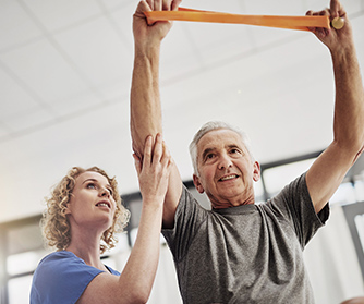 Physical therapist helping a man